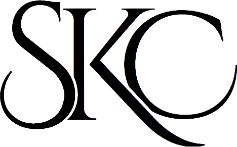 The letters SKC intertwined